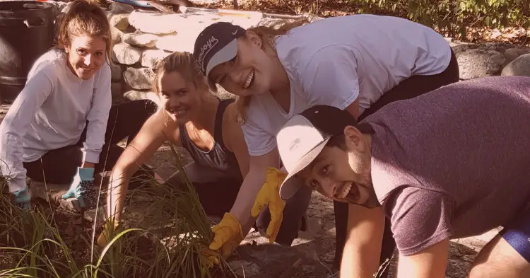 AlertMedia team gardening in Zilker Park, Austin, Texas