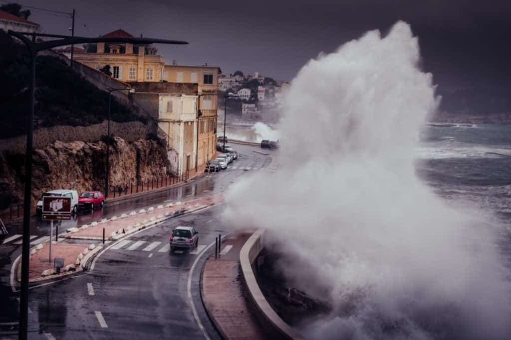 Scary Stormy Background With Big Sea Wave Splash Against City Road