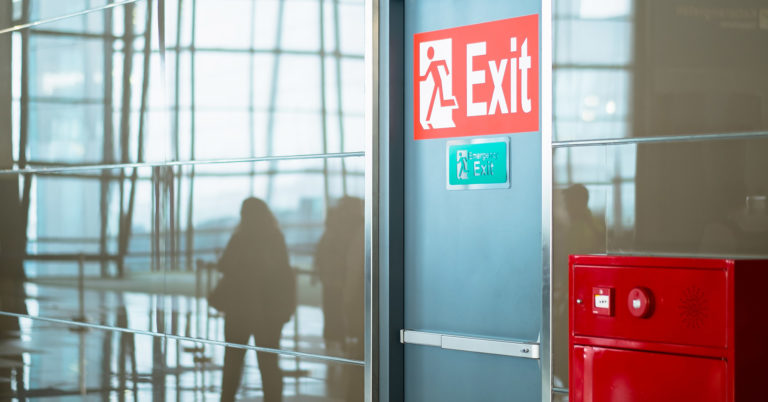 Door with fire evacuation signage