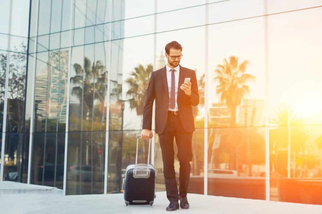 business traveler with safety app