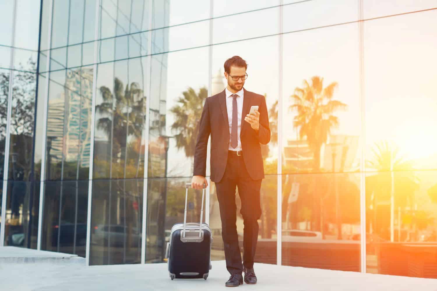 business traveler with safety app