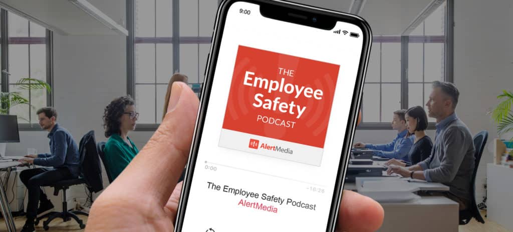 Hand holding mobile device playing The Employee Safety Podcast