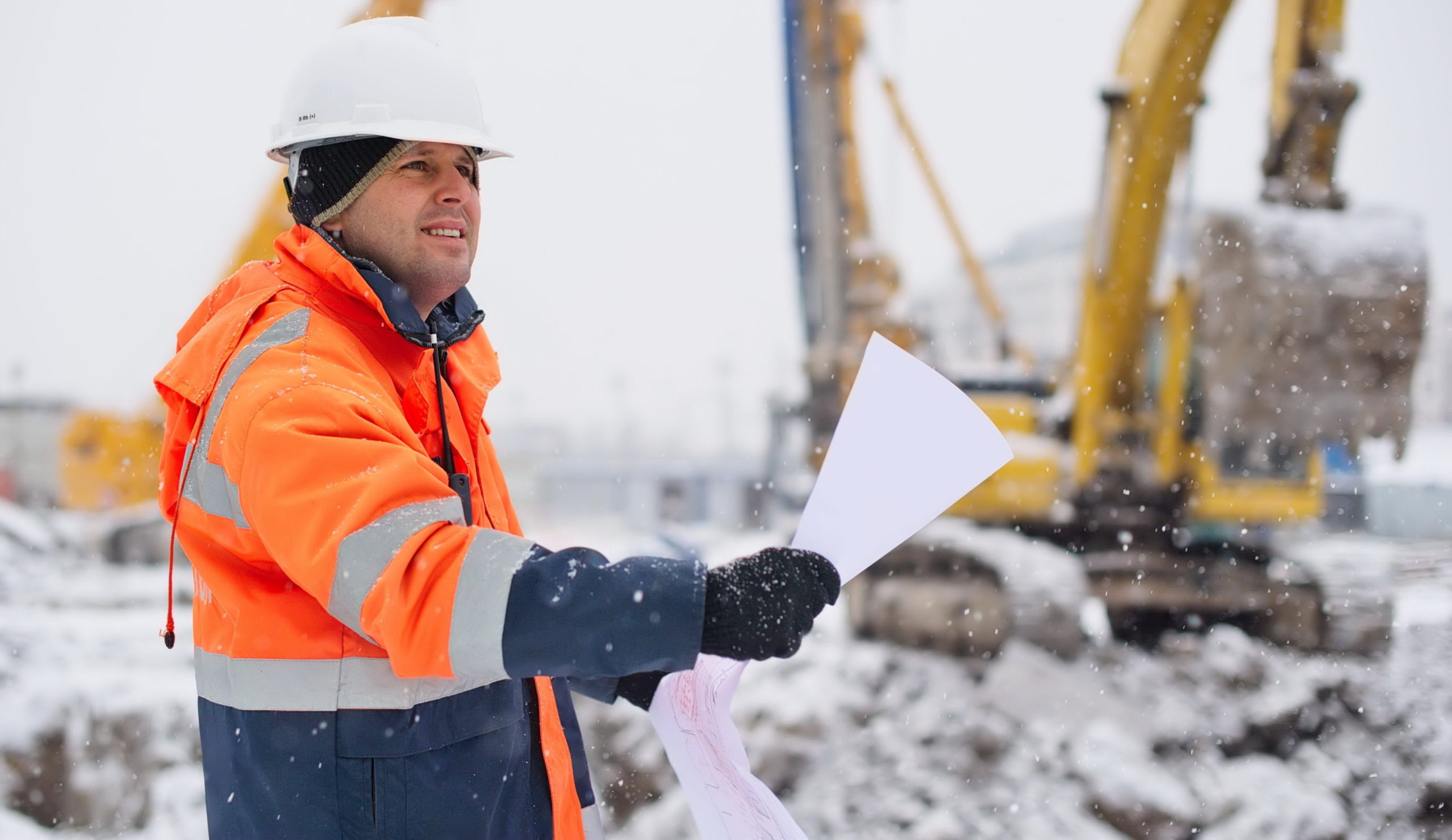 Employee working outdoors in snowy conditions