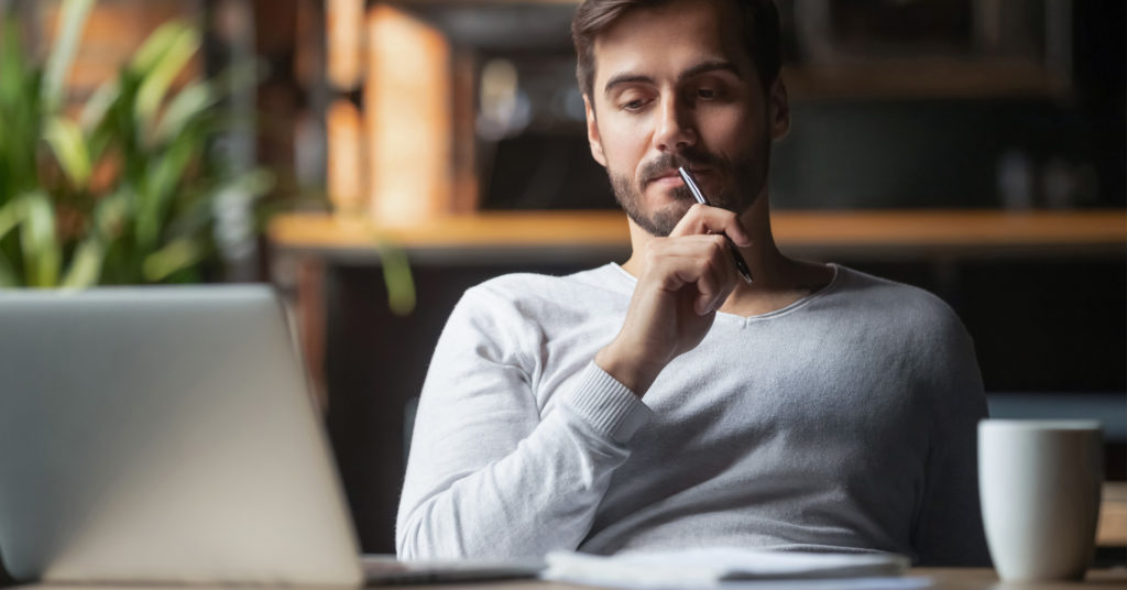 Man at laptop working in home office