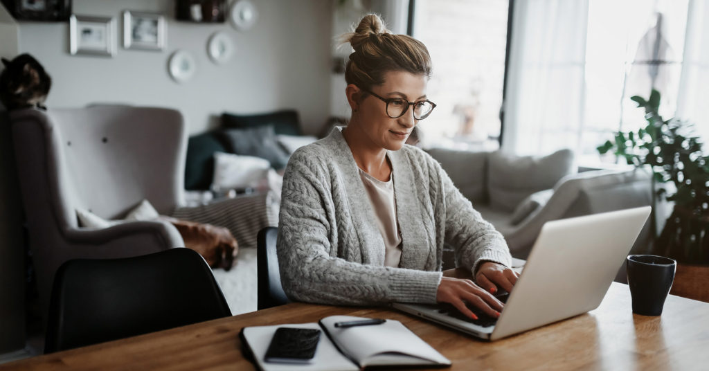 Woman working remotely from living room