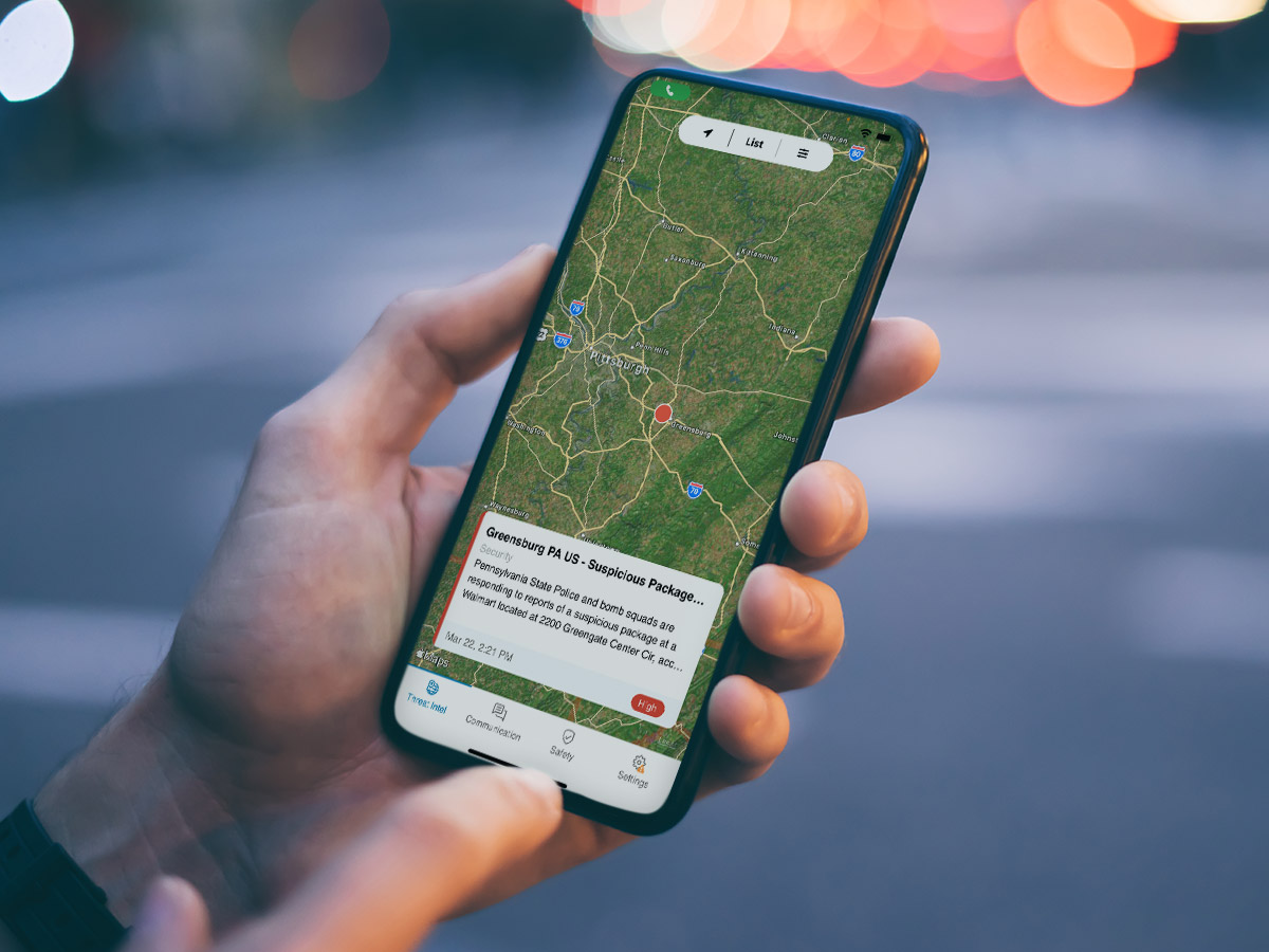 a mobile phone showing a map with a threat alert about a suspicious package