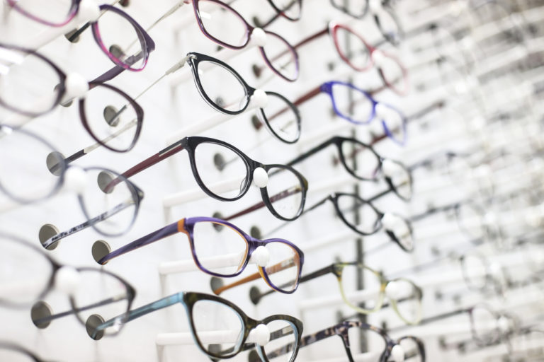 Eyeglasses in an eyewear store display.