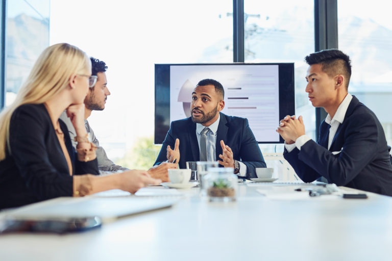 Young businesspeople having a meeting in an office.