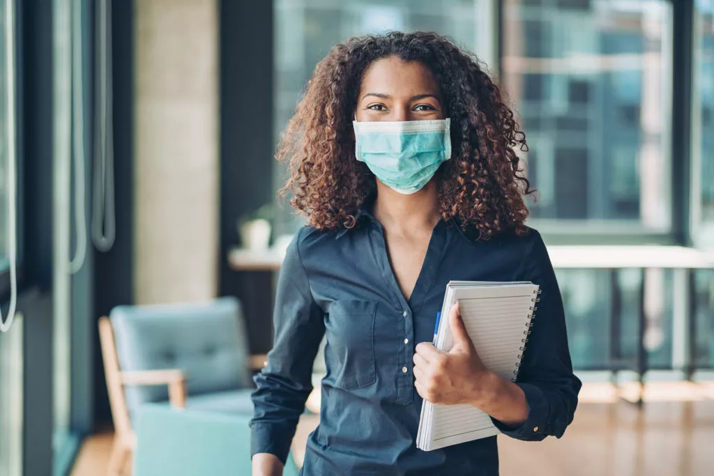 Businesswoman wearing a protective mask