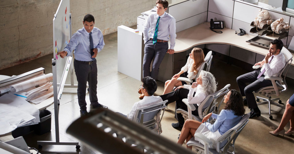 Office workers gathered in a meeting