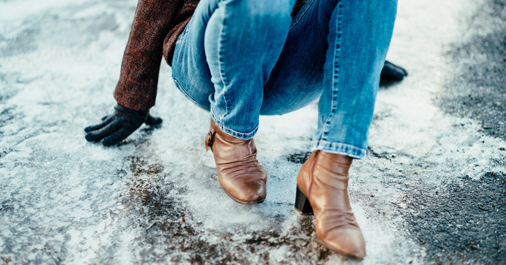 person slipping and falling on ice