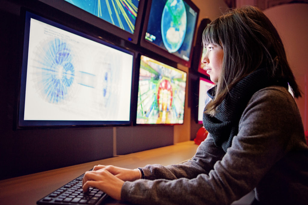 Young woman is working in a control room