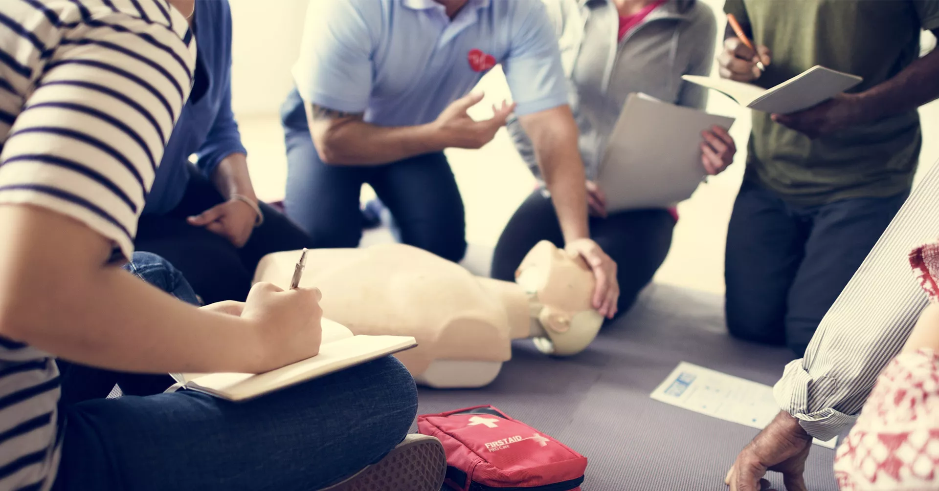 Group of employees takes first aid training
