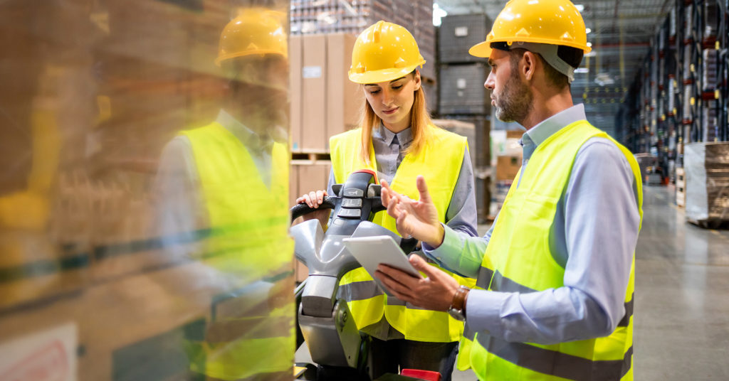 warehouse workers showing safety engagement