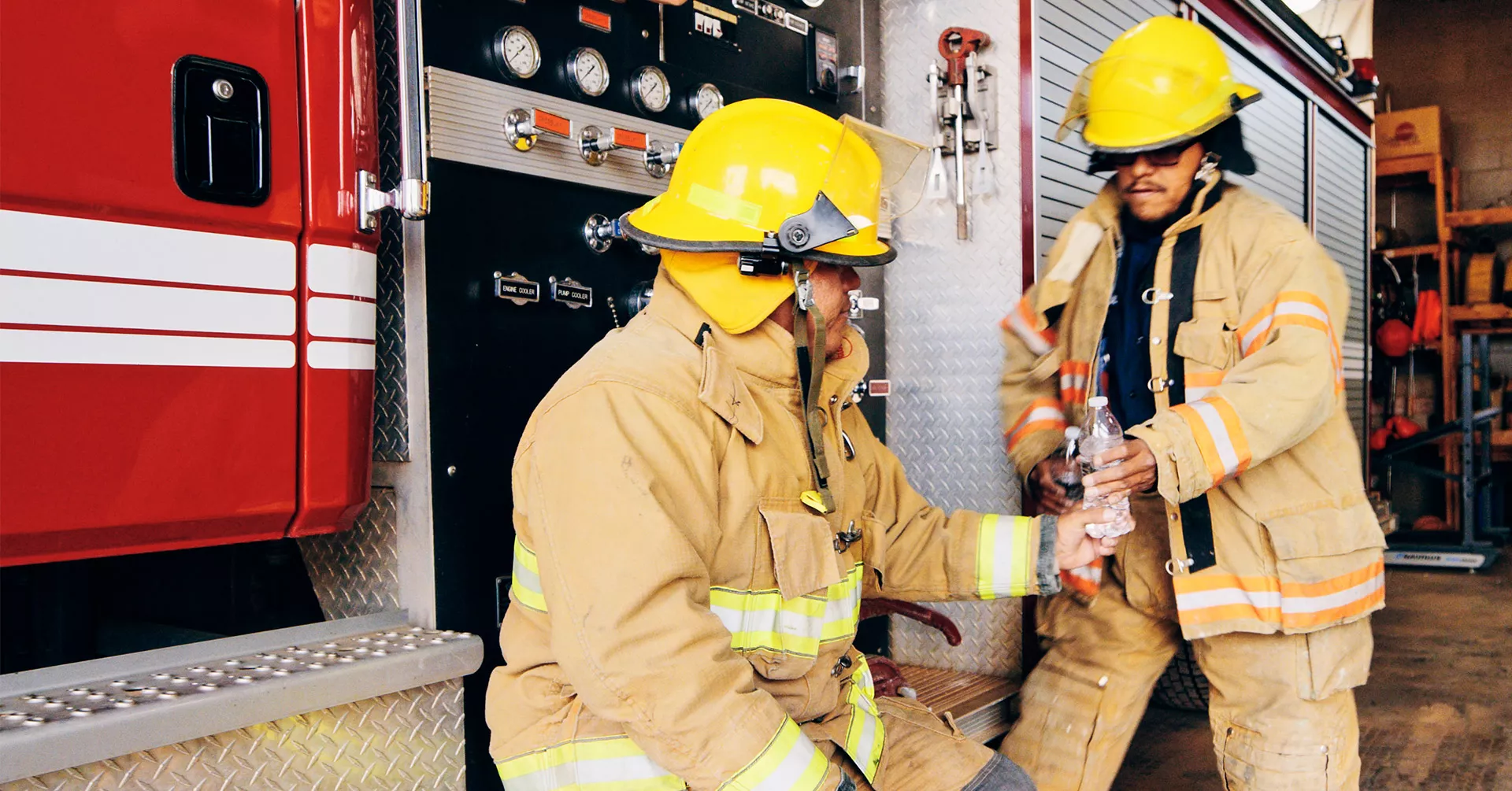 Firefighters drinking water in the heat