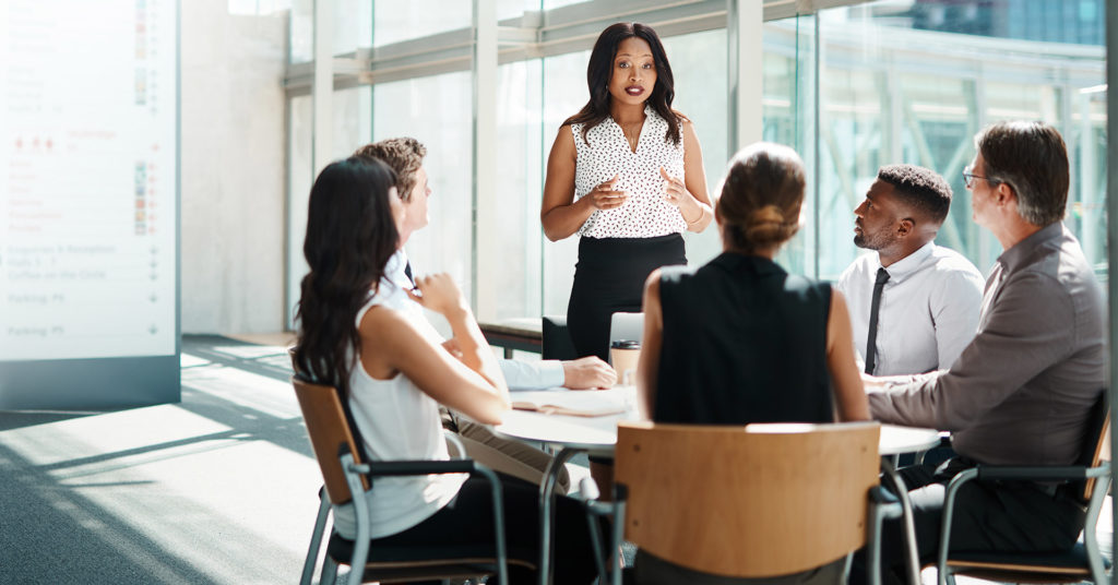 people working through tabletop exercise scenarios in a conference room