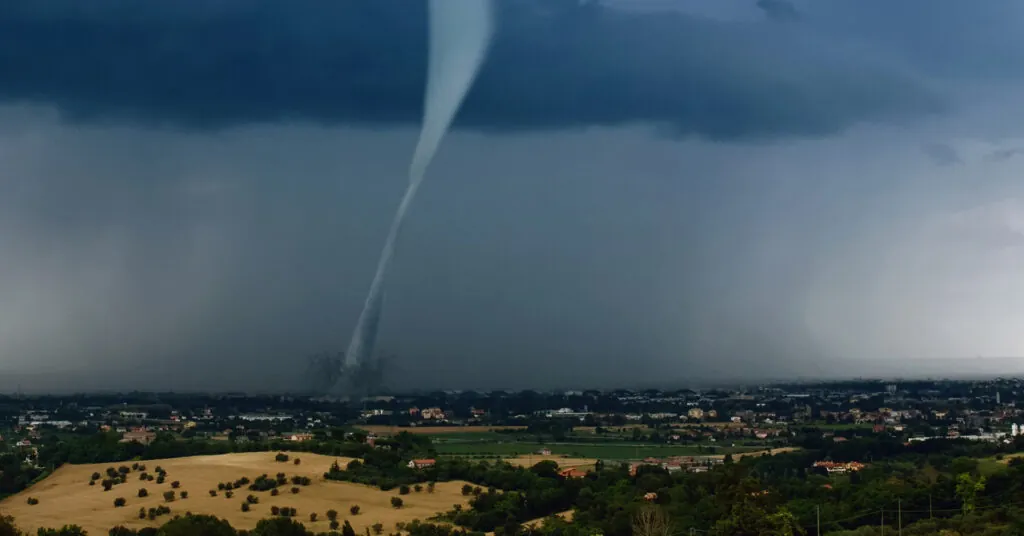 Tornado twister crossing the land