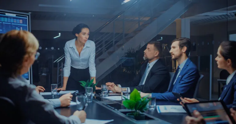 Workers at conference table perform a tabletop exercise