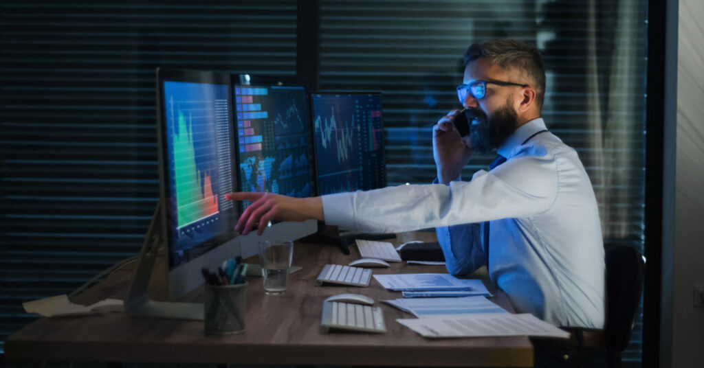 Worker monitors threats from desktop computer